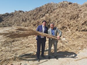 ICC Board Vice President Stuart Tom with Desert Board CEO Kamal Farah with palm waste that is the raw material for the Desertboard products