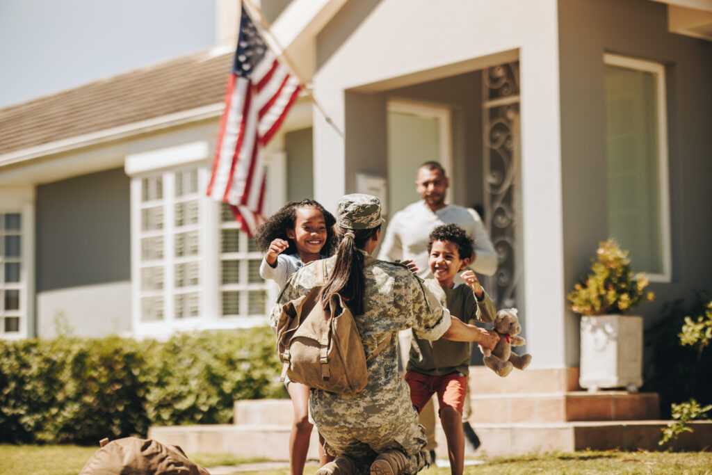 Military woman reuniting with her family.