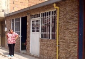 Housing upgrades that included strengthening the home in preparation for an additional story cost 35 percent of the average cost of a new home. A housing upgrade in Bogotá, Colombia, which included preparing the home for a second story to be safely added in the future. Image: Build Change