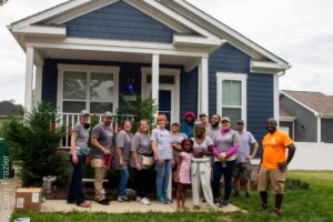 Pictured are volunteers repainting a house with Habitat for Humanity